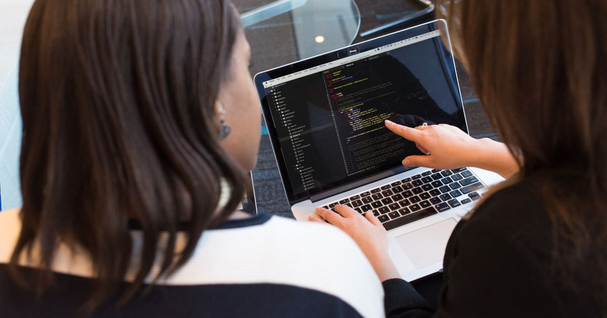 A person working at a laptop building a LinkedIn people search and exporting the results to a spreadsheet