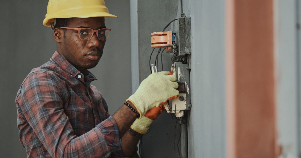 A field technician servicing building equipment